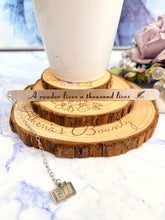 Load image into Gallery viewer, “A Reader Lives a Thousand Lives” Bookmark – Stainless Steel Bookmark with Book Charm