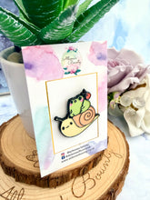 Load image into Gallery viewer, frog riding snail enamel pin UK
